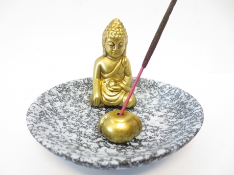 Incense holder golden buddha on a scale grey