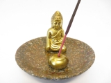 Incense holder golden buddha on a scale 